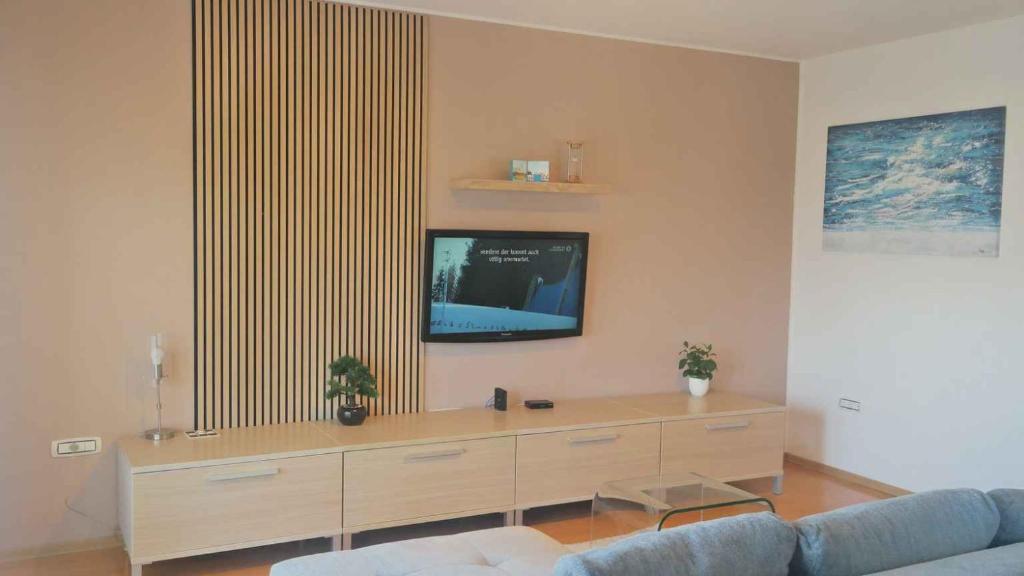a living room with a tv and a couch at Apartment in Cavle 54436 in Čavle
