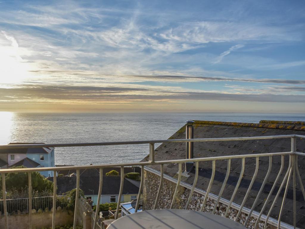 a view of the ocean from a balcony at Dicks View in Ventnor
