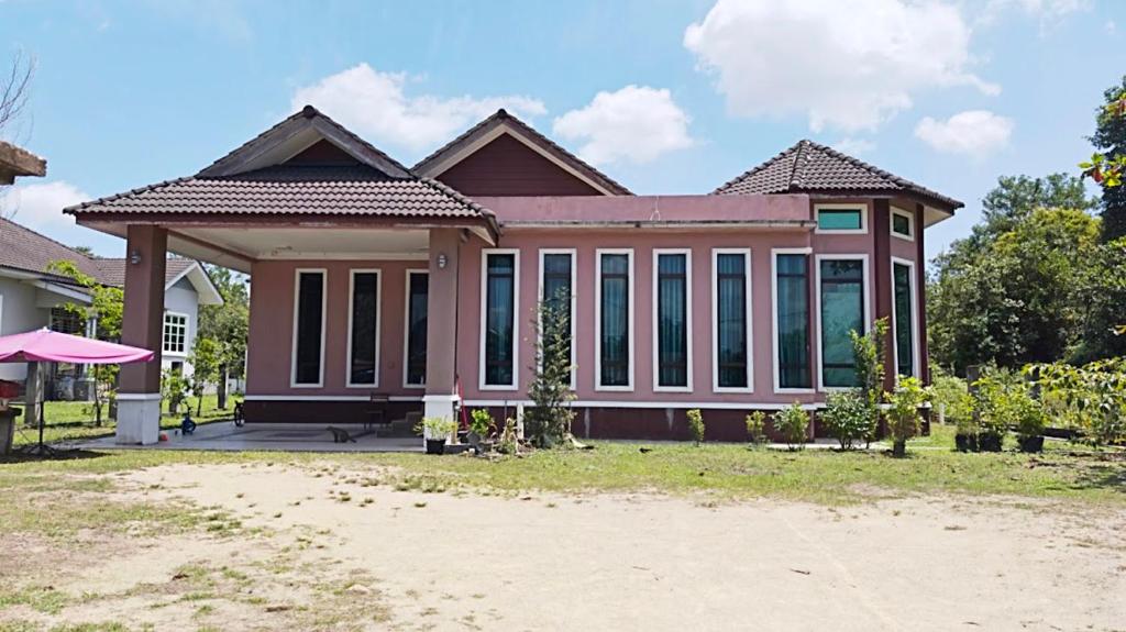 a house with a lot of windows at Casa Ariana Machang 3B3R in Macang