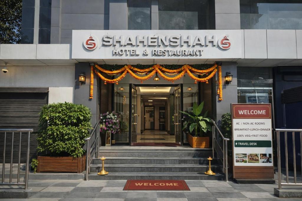 a building with the entrance to a hotel and restaurant at Shahenshah Hotel in Civil Lines, Prayagraj in Prayagraj