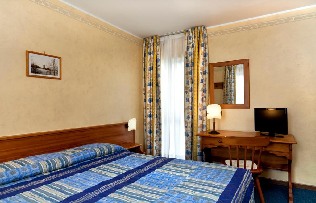 Postel nebo postele na pokoji v ubytování Hotel Beau Site