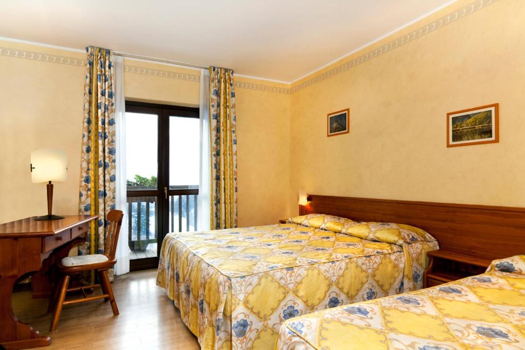 Postel nebo postele na pokoji v ubytování Hotel Beau Site