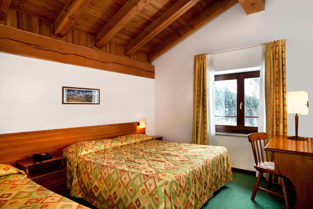 Postel nebo postele na pokoji v ubytování Hotel Beau Site