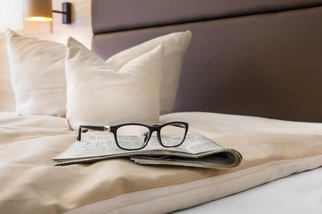Postel nebo postele na pokoji v ubytování Business Class Hotel Häckermühle