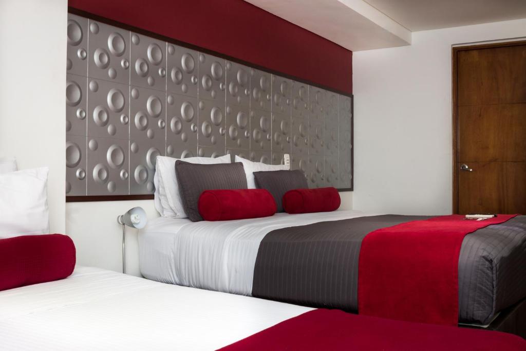 Postel nebo postele na pokoji v ubytování Hotel Florencia Plaza