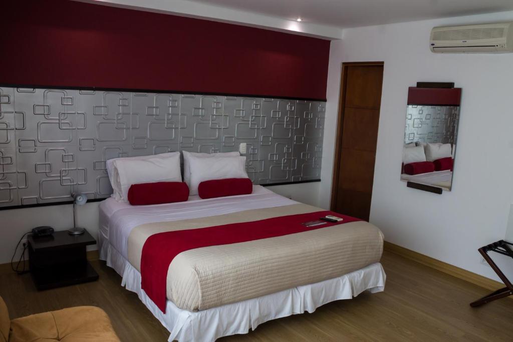 Postel nebo postele na pokoji v ubytování Hotel Florencia Plaza