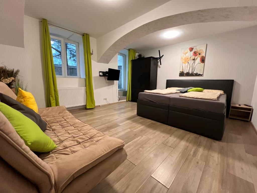 a living room with a couch and a table at Brilliant Souterrain Apt - Prter Amuesement Park in Vienna