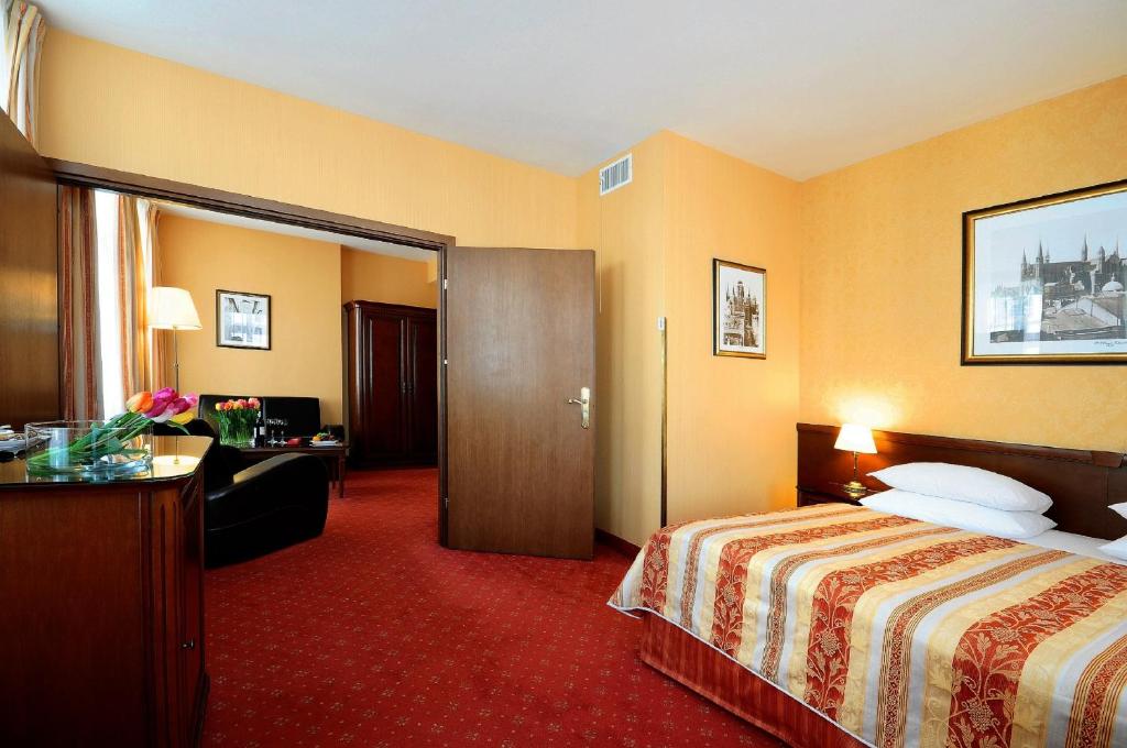 Postel nebo postele na pokoji v ubytování Hotel Wolne Miasto Old Town Gdańsk