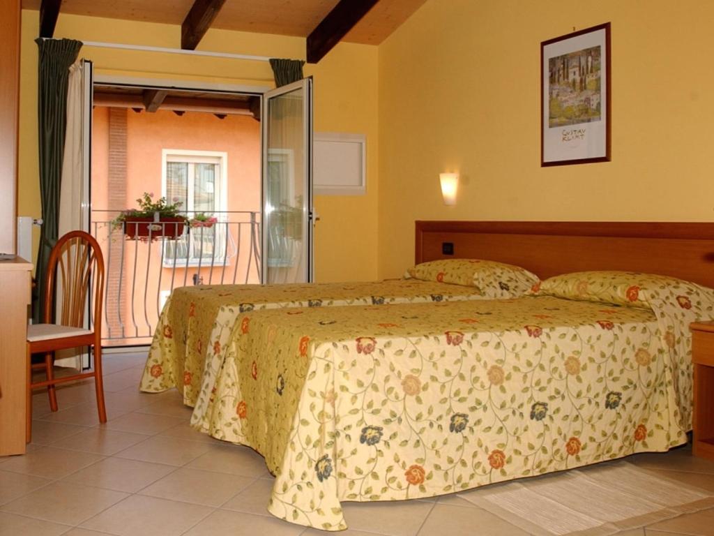 Postel nebo postele na pokoji v ubytování Hotel Agata