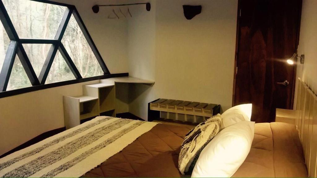 Postel nebo postele na pokoji v ubytování Cuyinco Domos