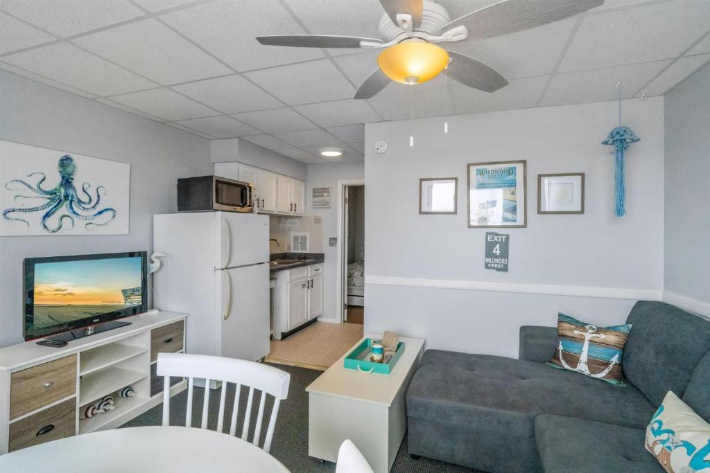 a living room with a couch and a tv at 6701 Atlantic Ave, Unit 301 in Wildwood Crest