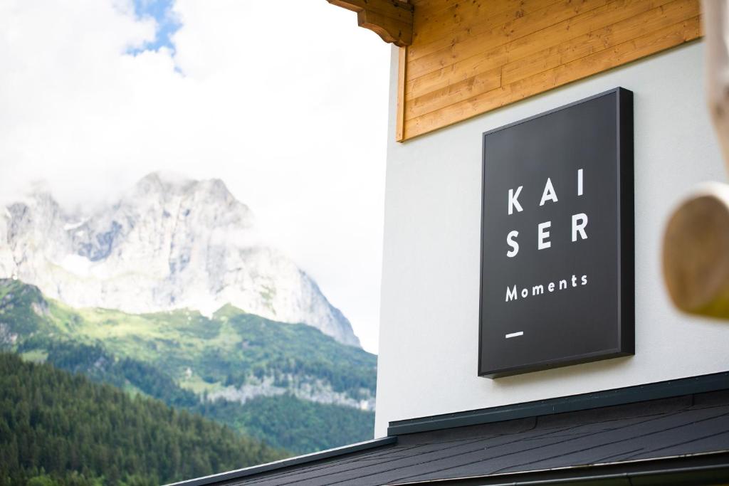 a sign on the side of a building with mountains at KaiserMoments in Going am Wilden Kaiser