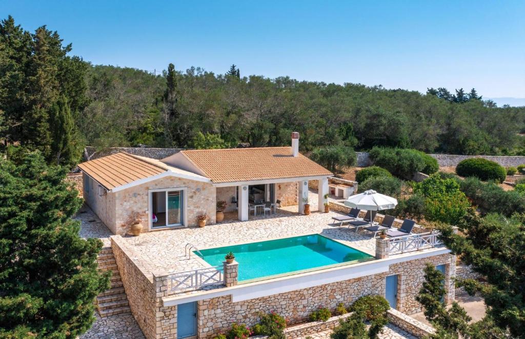 an aerial view of a house with a swimming pool at Villa Asteri in Vlachopoulátika