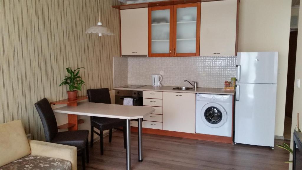 Kuchyň nebo kuchyňský kout v ubytování Apartments Carrera