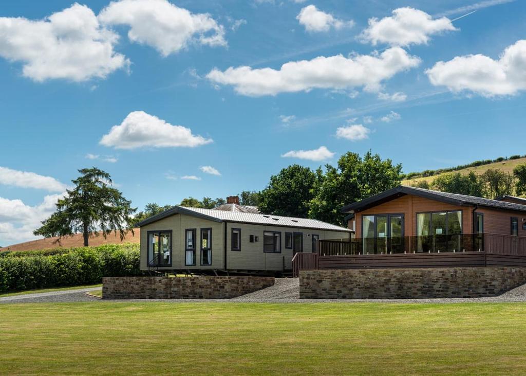 a home with a large yard with a house at Rockbridge Country Park in Presteigne