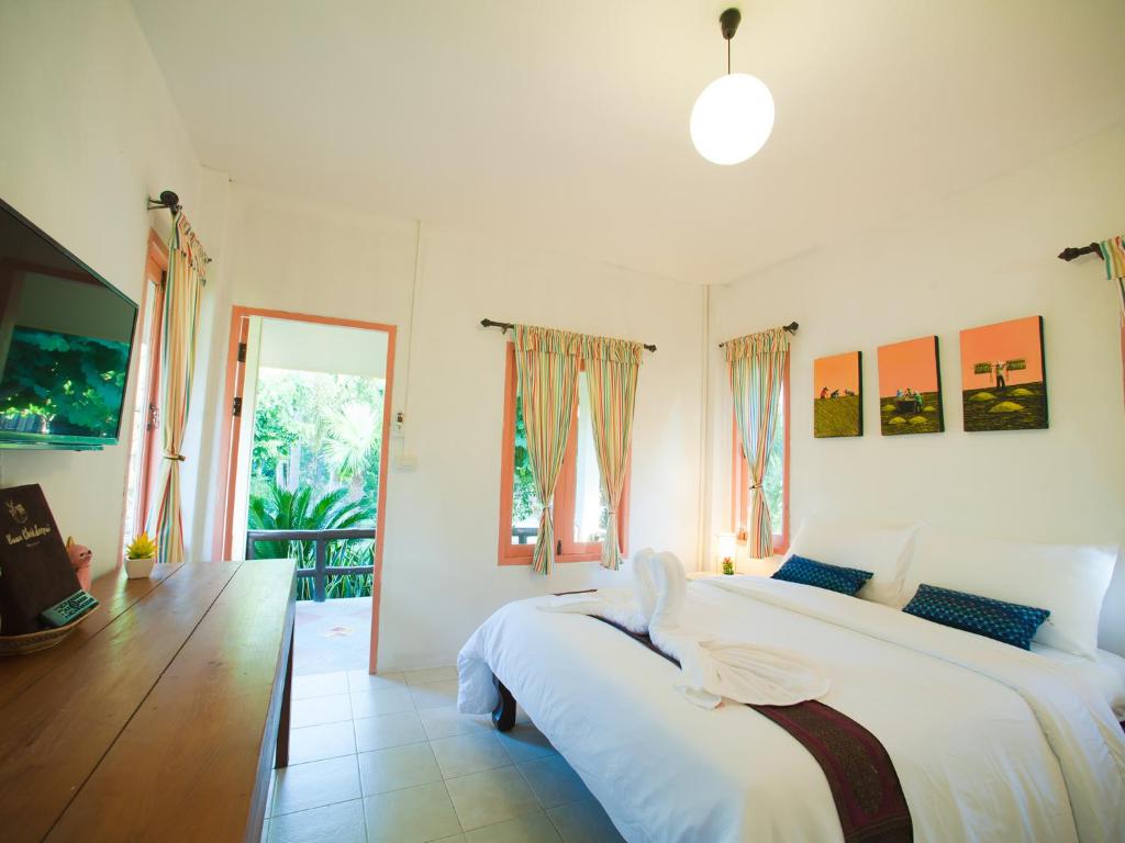 Postel nebo postele na pokoji v ubytování Baan Chokdee Pai Resort