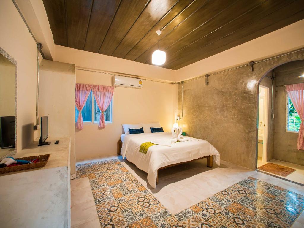Postel nebo postele na pokoji v ubytování Baan Chokdee Pai Resort