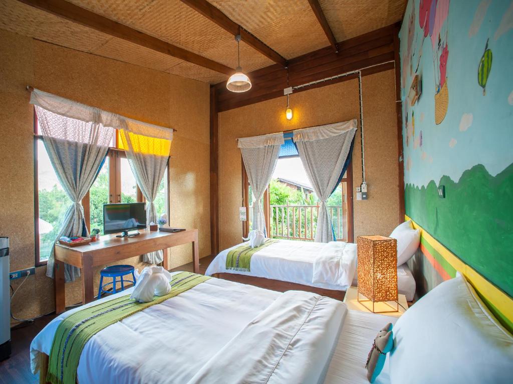 Postel nebo postele na pokoji v ubytování Baan Chokdee Pai Resort