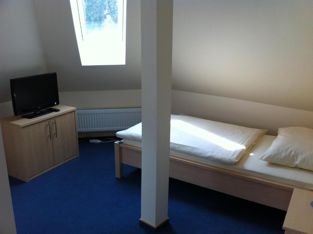 Postel nebo postele na pokoji v ubytování Hotel Appart
