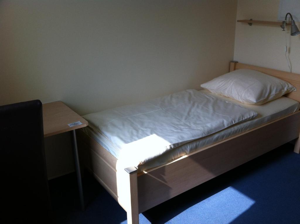 Postel nebo postele na pokoji v ubytování Hotel Appart