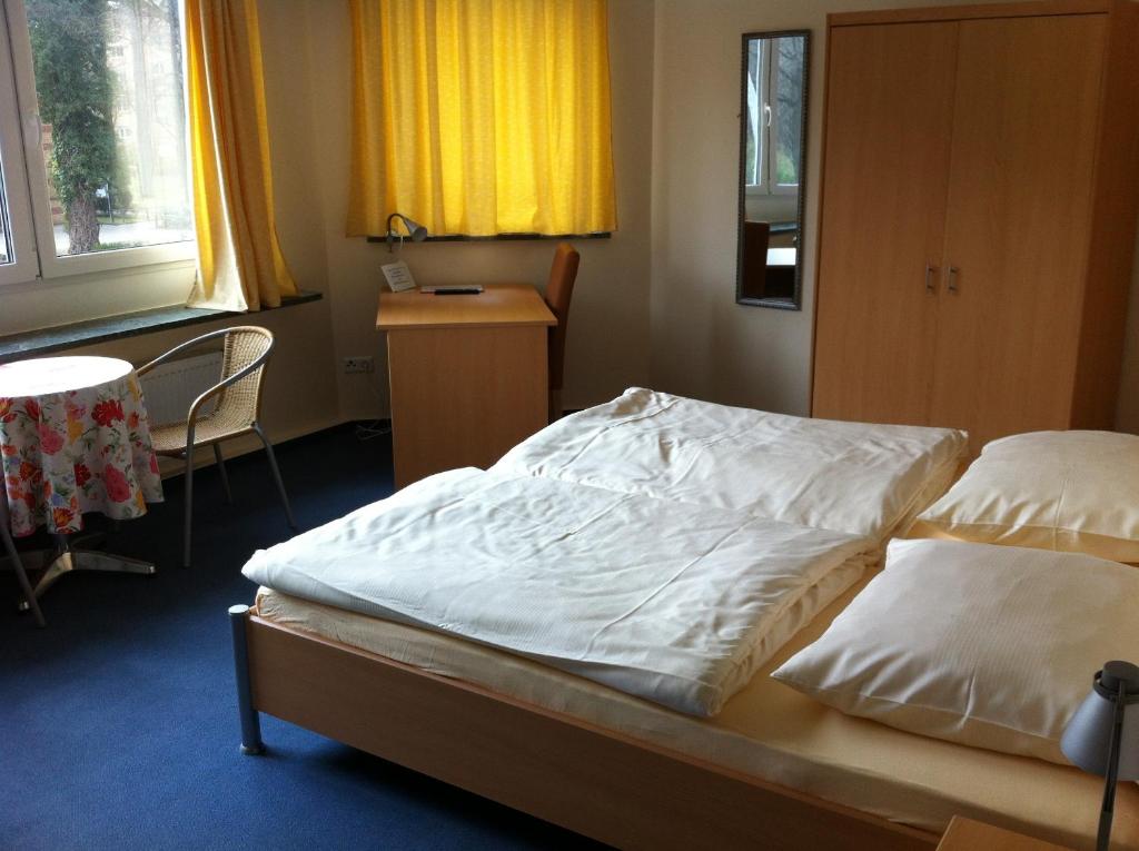 Postel nebo postele na pokoji v ubytování Hotel Appart