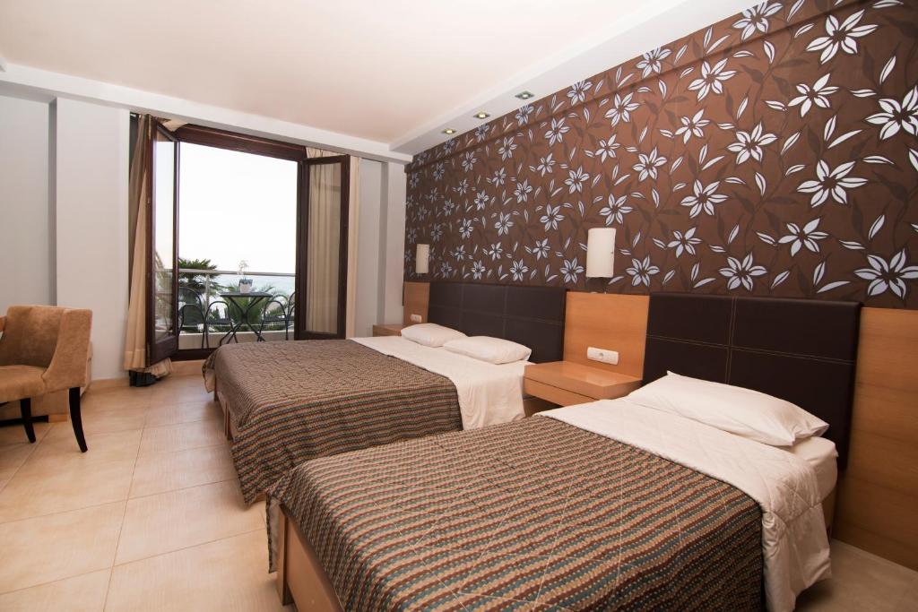 Postel nebo postele na pokoji v ubytování Mistral Hotel