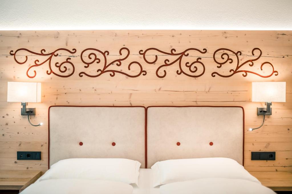 Postel nebo postele na pokoji v ubytování Hotel Maria