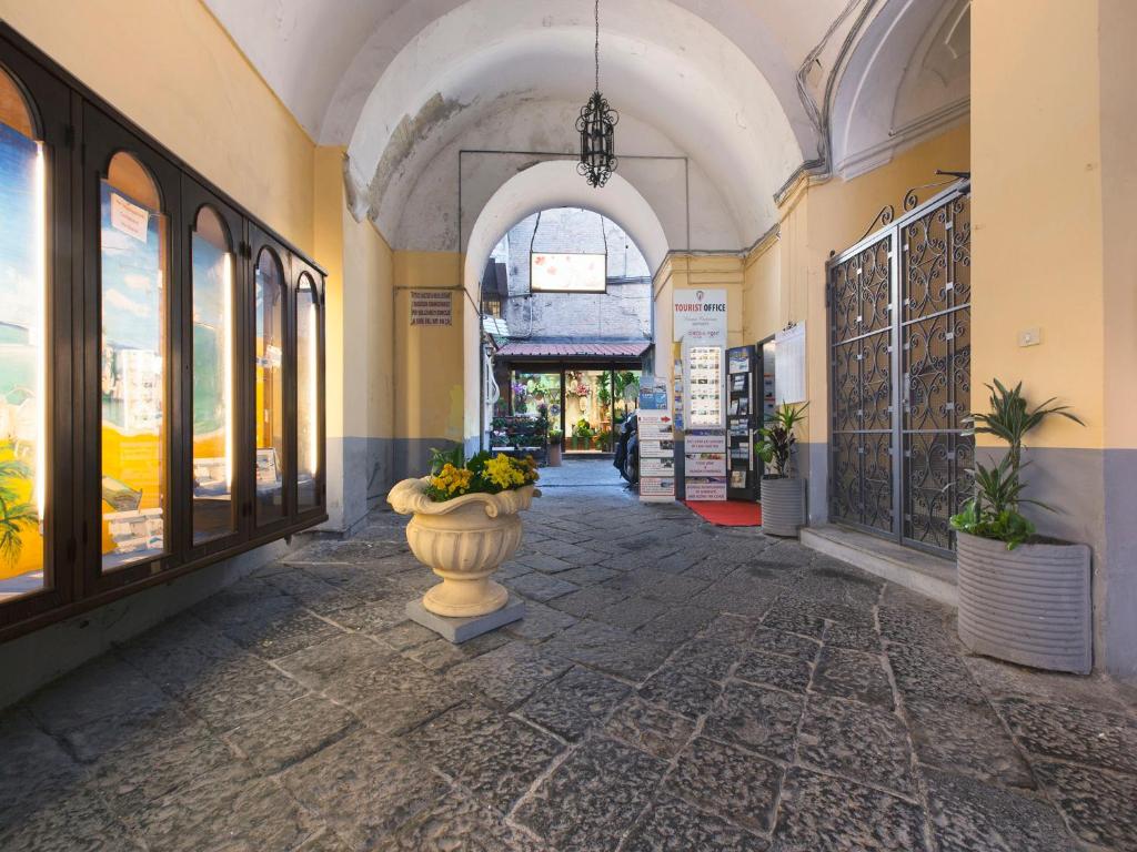 a building with a vase in the middle of a hallway at Donna Caterina in Sorrento