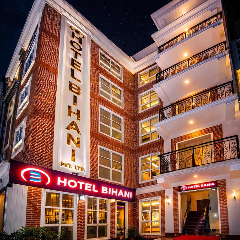 een hotelgebouw met een hotelbord ervoor. bij Hotel Bihani in Kathmandu