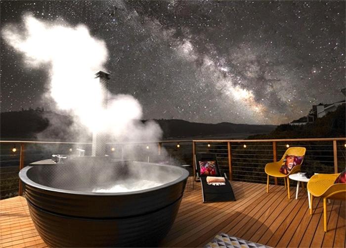 a bath tub on a deck with a starry sky at Number 1 at SuPaViews in Wilderness