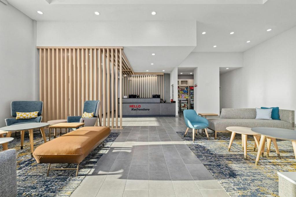 a lobby with couches and chairs and tables at TownePlace Suites by Marriott Murfreesboro in Murfreesboro