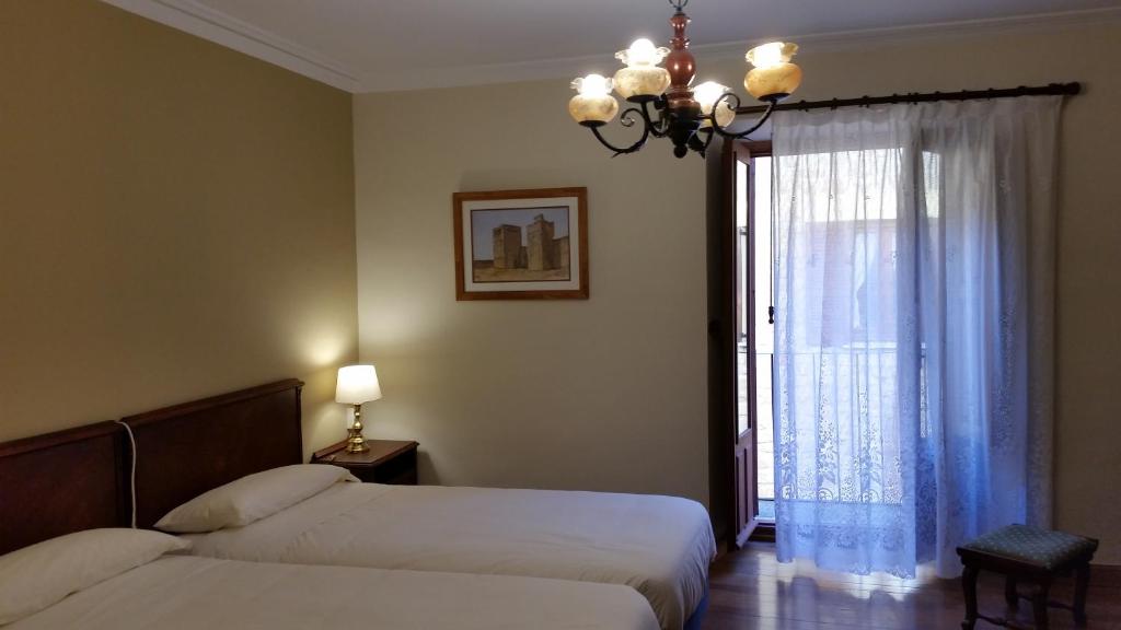 Postel nebo postele na pokoji v ubytování Casa de Landa