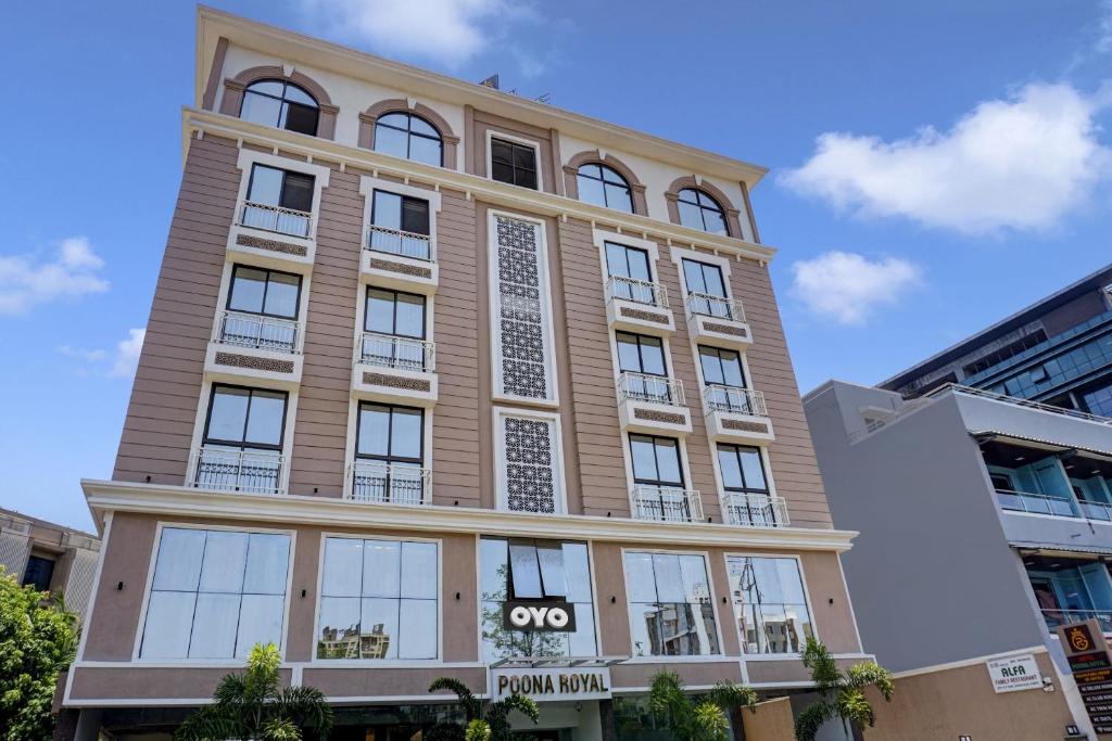 a large building with windows on the side of it at Townhouse Poona Royal in Pune