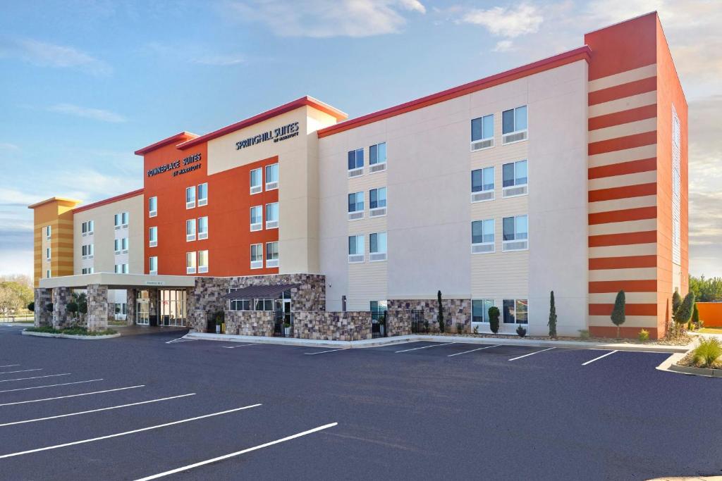 an empty parking lot in front of a hotel at SpringHill Suites by Marriott Locust Grove in Locust Grove