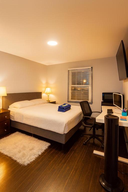 a bedroom with a bed and a desk with a computer at Cozy MasterRoom Gresham Park in Atlanta