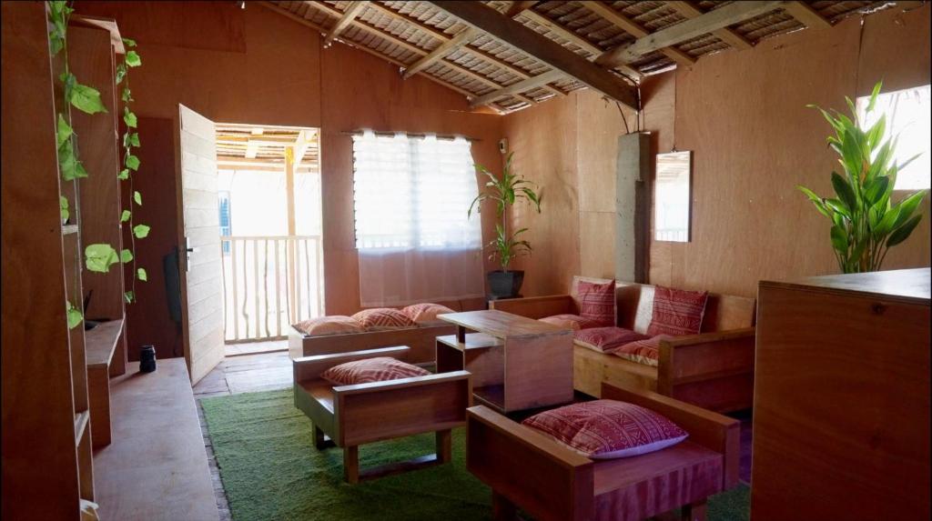 a living room with a couch and a table at Nana's House in San Isidro