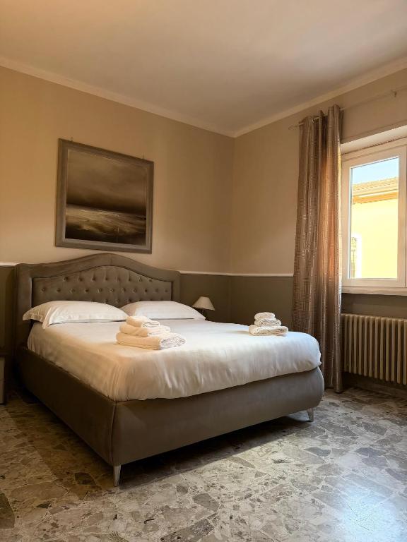 a bedroom with a bed with two towels on it at B&B Sorgenti del Gari in Cassino