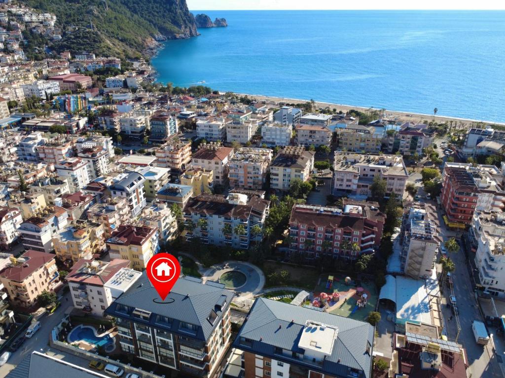 an aerial view of a city with a red sign at SA Apartments! Luxury 2BR with Private Beach Access in Alanya
