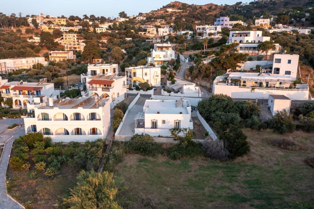 an aerial view of a town with white houses at Arezina's Apartment in Vromolithos