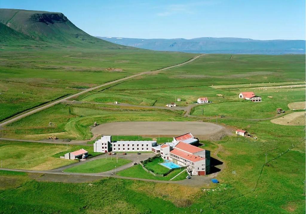 an aerial view of a building in a field at Hunavellir Guesthouse in Blönduós
