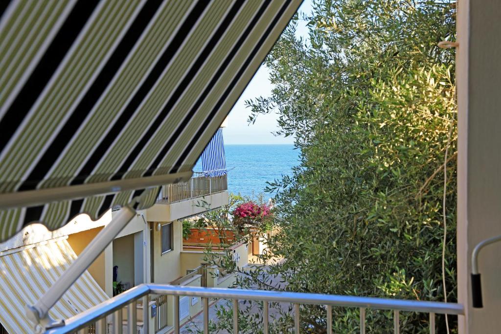 a view of the ocean from the balcony of a house at Argo apartment, fronte mare, kaucana beach in Villaggio Azzurro