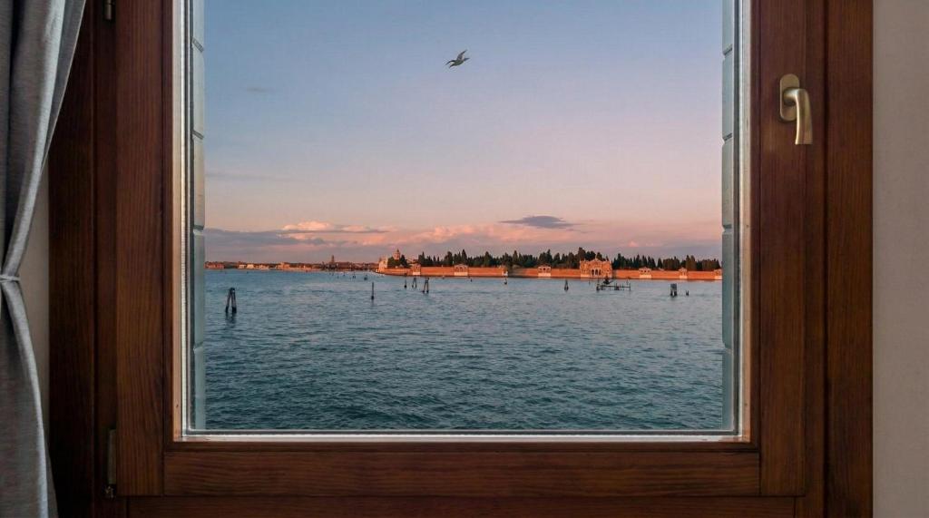 a view of the water from a window at Ca' sull' Acqua in Venice