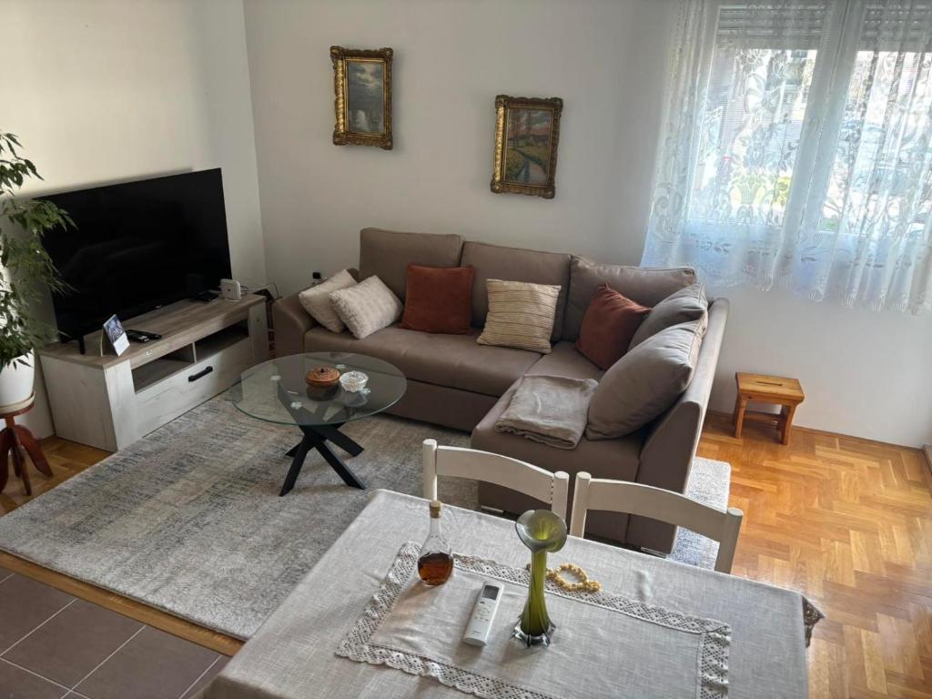 a living room with a couch and a table at Lana in Trebinje