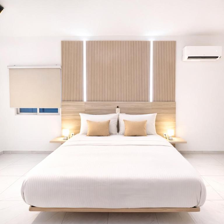 Un pat sau paturi într-o cameră la Silver Apartment Abidjan
