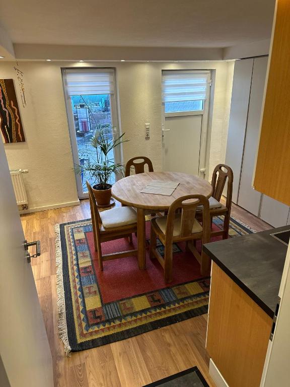 a kitchen and dining room with a table and chairs at Ferienwohnung Im Einklang in Buchen