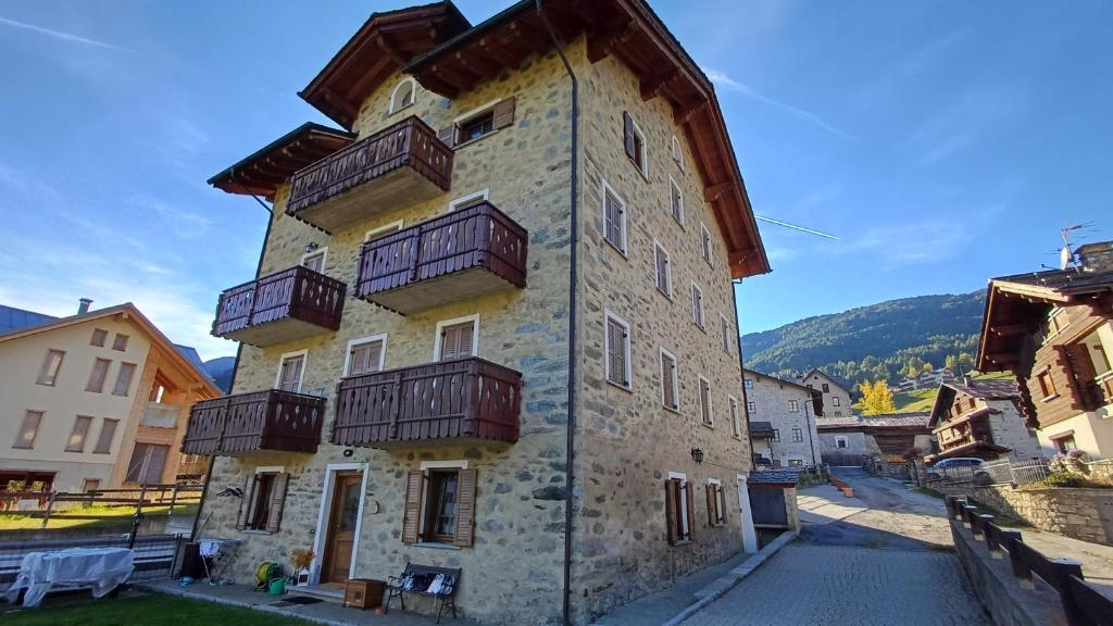a building with balconies on the side of it at Sambor apartment in Oga