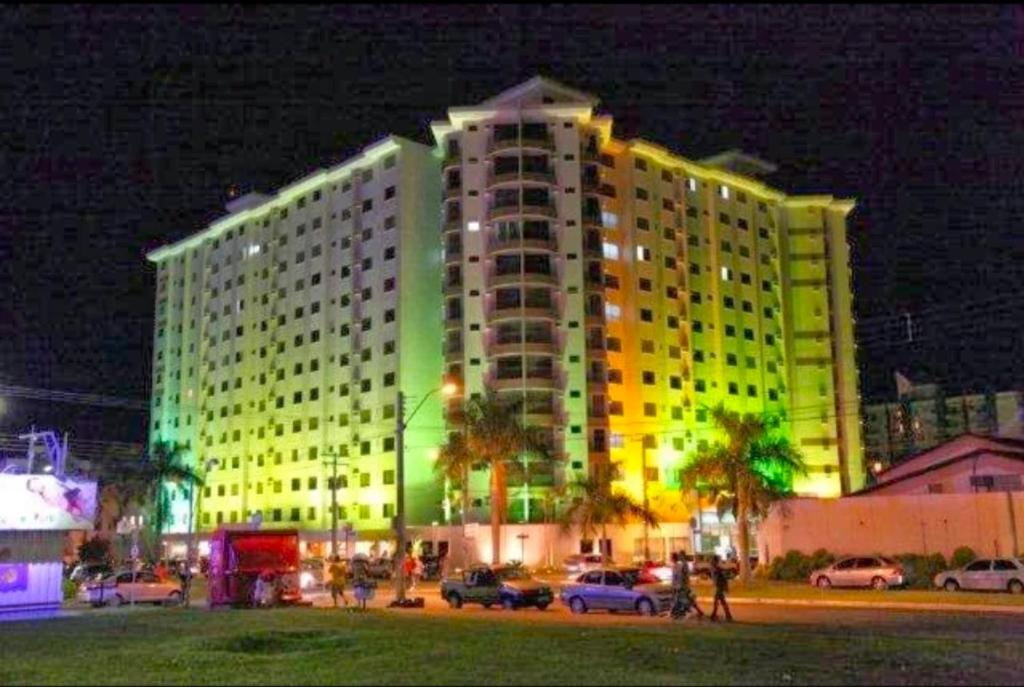 a large building is lit up at night at Boulevard suíte hotel suíte 1220 in Caldas Novas