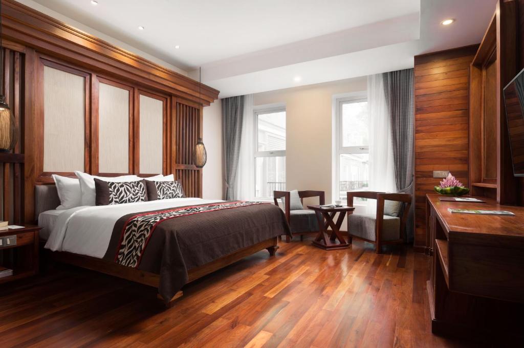 Postel nebo postele na pokoji v ubytování J7 Angkor Hotel