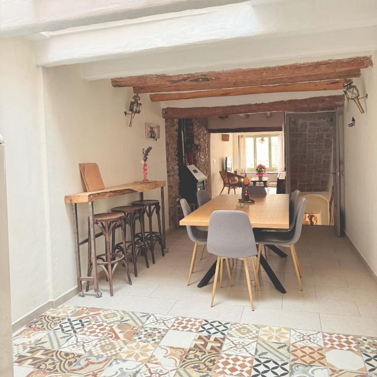 a dining room with a table and chairs at Escapada rural en Nulles, cerca de Tarragona in Nulles