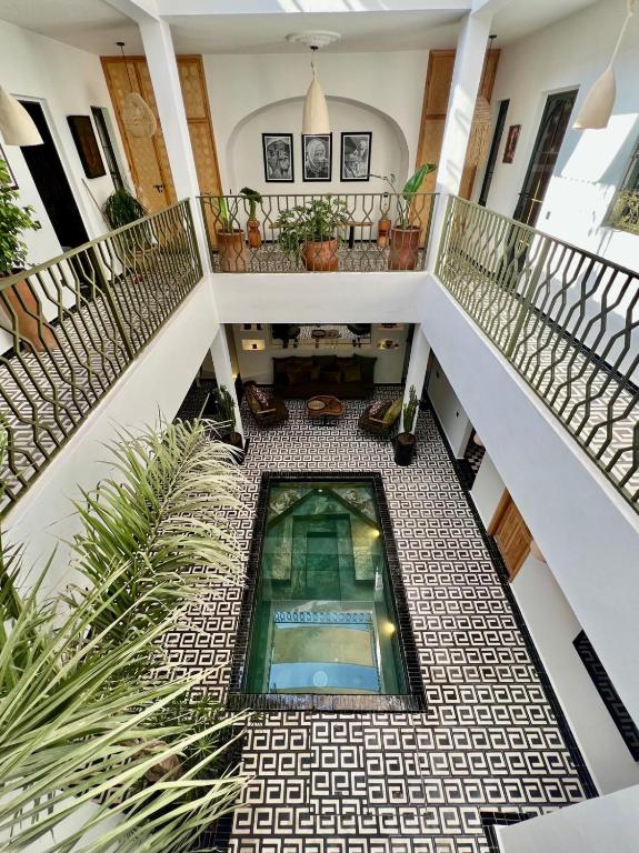 a view from the top of a building with a staircase at Riad OUAR - Once Upon A Riad in Marrakesh